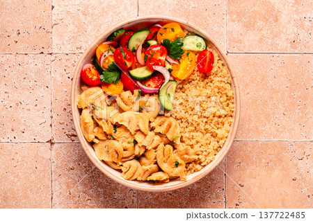 Bowl of quinoa with vegan soy meat and vegetables. Bowl of quinoa with vegan soy meat and vegetables. 137722485