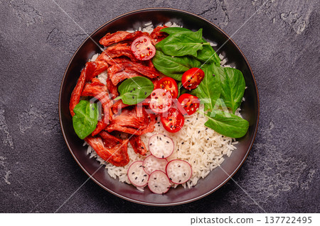 Bowl with vegan fried soy meat and vegetables served with boiled rice. Bowl with vegan fried soy meat and vegetables served with boiled rice. 137722495