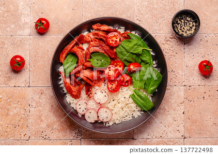 Bowl with vegan fried soy meat and vegetables served with boiled rice. 137722498