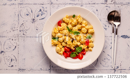pasta in a plate with tomato sauce. pasta in a plate with tomato sauce. 137722506