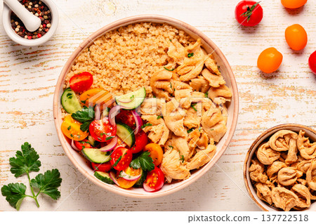 Bowl of quinoa with vegan soy meat and vegetables. 137722518