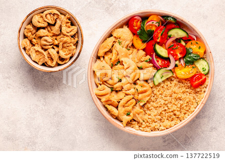 Bowl of quinoa with vegan soy meat and vegetables. 137722519
