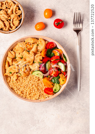 Bowl of quinoa with vegan soy meat and vegetables. 137722520