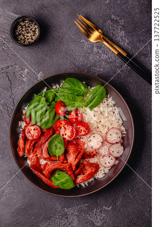 Bowl with vegan fried soy meat and vegetables served with boiled rice. Bowl with vegan fried soy meat and vegetables served with boiled rice. 137722525