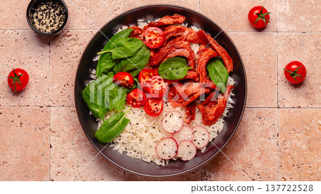 Bowl with vegan fried soy meat and vegetables served with boiled rice. Bowl with vegan fried soy meat and vegetables served with boiled rice. 137722528