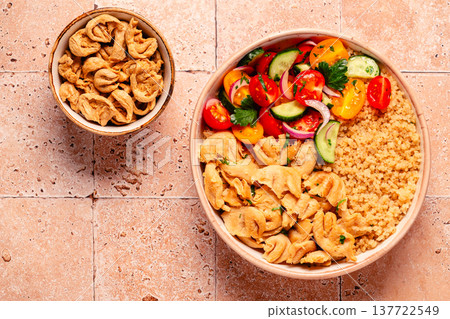 Bowl of quinoa with vegan soy meat and vegetables. Bowl of quinoa with vegan soy meat and vegetables. 137722549