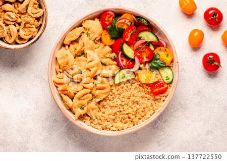 Bowl of quinoa with vegan soy meat and vegetables. Bowl of quinoa with vegan soy meat and vegetables. 137722550