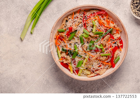 Bowl of rice noodles with vegan soy meat and vegetables. Bowl of rice noodles with vegan soy meat and vegetables. 137722553