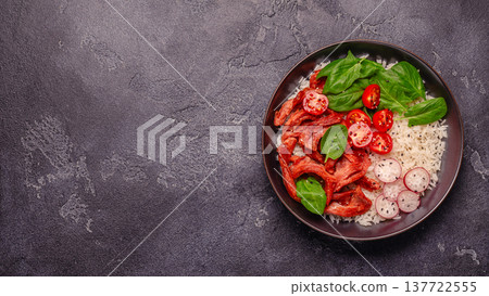 Bowl with vegan fried soy meat and vegetables served with boiled rice. Bowl with vegan fried soy meat and vegetables served with boiled rice. 137722555