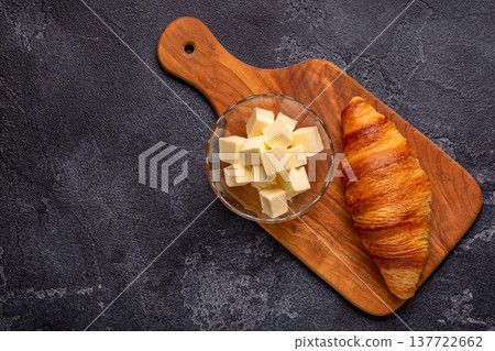 French croissant. Freshly baked croissants with butter French croissant. Freshly baked croissants with butter 137722662