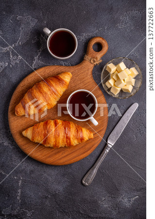 French croissant. Freshly baked croissants with butter coffee 137722663