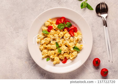 pasta in a plate with tomato sauce. pasta in a plate with tomato sauce. 137722720