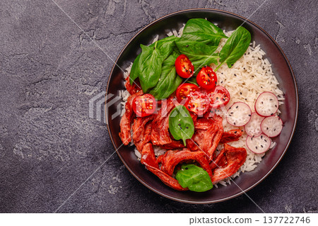 Bowl with vegan fried soy meat and vegetables served with boiled rice. Bowl with vegan fried soy meat and vegetables served with boiled rice. 137722746