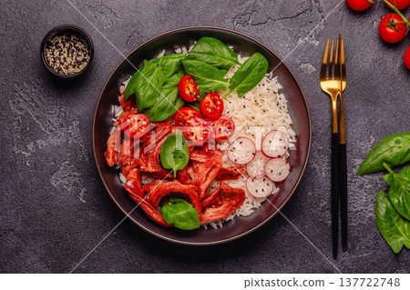 Bowl with vegan fried soy meat and vegetables served with boiled rice. Bowl with vegan fried soy meat and vegetables served with boiled rice. 137722748