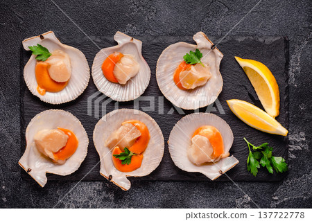 Raw scallops with lemon parsley Raw scallops with lemon parsley 137722778
