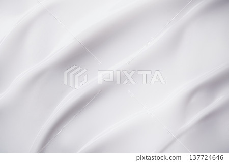 Smooth white cream texture forming elegant flowing waves and swirls 137724646
