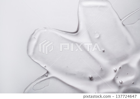Transparent cosmetic gel texture creating an abstract background Transparent cosmetic gel texture creating an abstract background 137724647