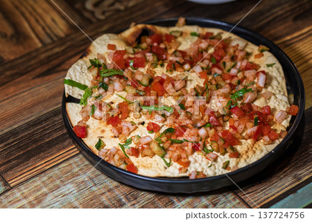 Crispy Indian flatbread with refreshing chopped vegetables Crispy Indian flatbread with refreshing chopped vegetables 137724756