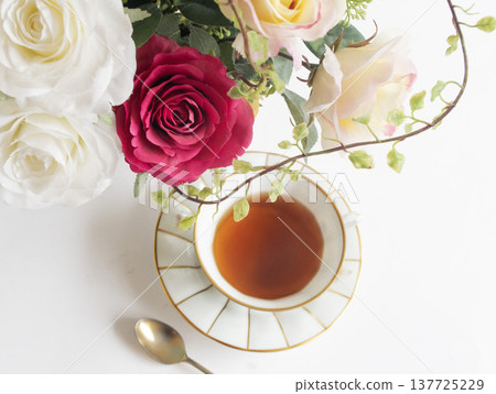 Tea and a bouquet on the table - Teatime Tea and a bouquet on the table - Teatime 137725229