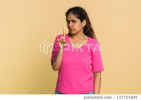 Indian woman shaking finger and head disapprovingly, showing clear no warning to camera 137725895