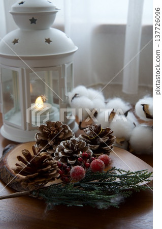 Pine cones, red berries, cottony fluff, and lanterns Pine cones, red berries, cottony fluff, and lanterns 137726096