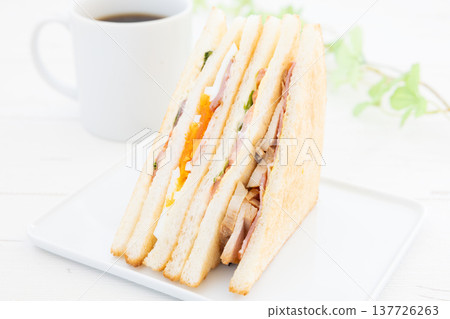 A delicious club sandwich and coffee for breakfast. 137726263