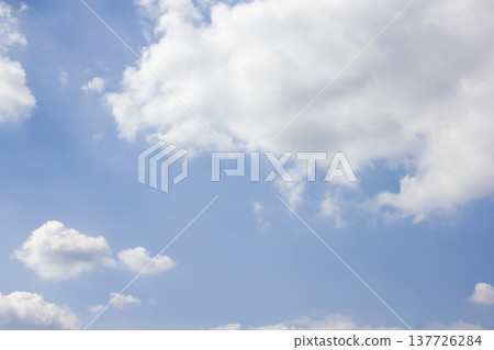 Blue sky with puffy clouds Blue sky with puffy clouds 137726284