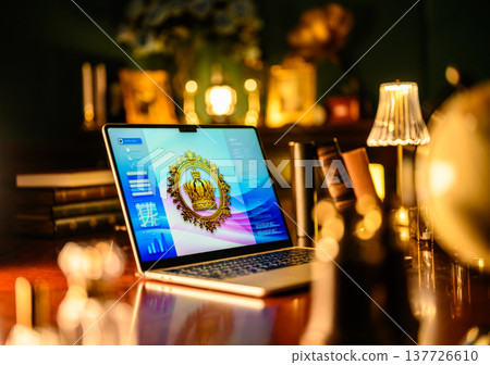 A PC displaying a crown in a luxurious study. A PC displaying a crown in a luxurious study. 137726610