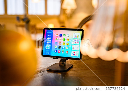 Tablet home screen on stand Tablet home screen on stand 137726624