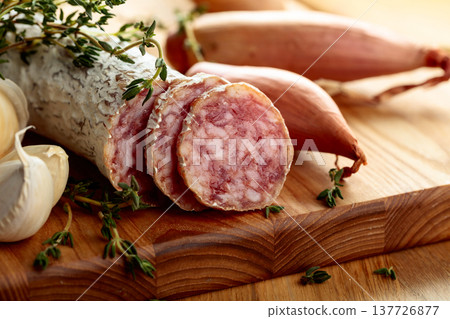 Dry-cured sausage with thyme, garlic, and onion. Dry-cured sausage with thyme, garlic, and onion. 137726877