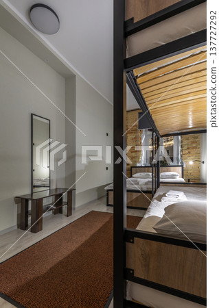Modern Hostel Dormitory Room with Bunk Beds and Double Bed Modern Hostel Dormitory Room with Bunk Beds and Double Bed 137727292