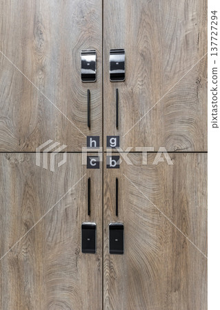 Close-up of Modern Wooden Lockers with Electronic Keycard Locks Close-up of Modern Wooden Lockers with Electronic Keycard Locks 137727294