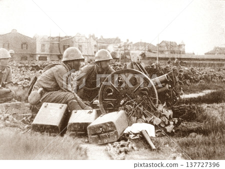 Old photo from 1937, Shanghai during the Sino-Japanese War, Japanese Army firing cannons on the battlefield Old photo from 1937, Shanghai during the Sino-Japanese War, Japanese Army firing cannons on the battlefield 137727396