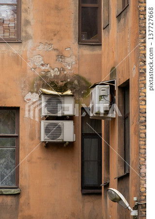 air conditioning on facade of building, air cooling in hot weather.  137727668