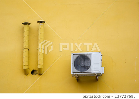 air conditioning on facade of building, air cooling in hot weather.  137727693