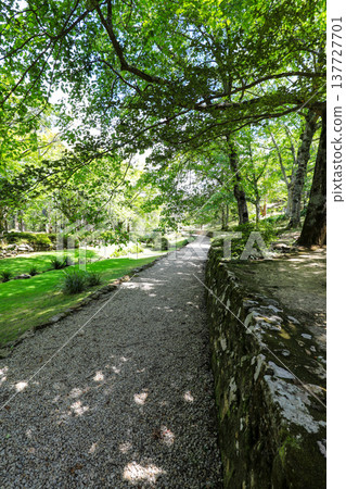 Scenic view across Everglades Gardens in the Blue Mountains of New South Wales, Australia, showing landscaped gardens, pathways and surrounding mountain scenery. Scenic view across Everglades Gardens in the Blue Mountains of New South Wales, Australia, showing landscaped gardens, pathways and surrounding mountain scenery. 137727701