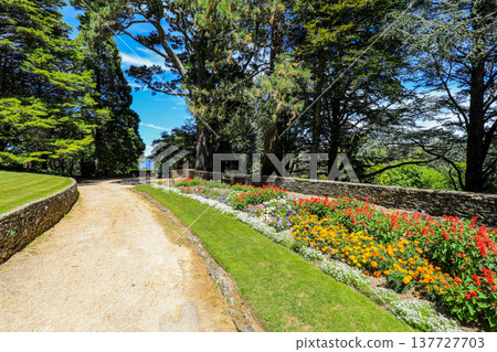 Scenic view across Everglades Gardens in the Blue Mountains of New South Wales, Australia, showing landscaped gardens, pathways and surrounding mountain scenery. Scenic view across Everglades Gardens in the Blue Mountains of New South Wales, Australia, showing landscaped gardens, pathways and surrounding mountain scenery. 137727703