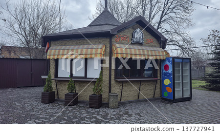 A modern wooden cafe or restaurant with panoramic windows in a city park A modern wooden cafe or restaurant with panoramic windows in a city park 137727941