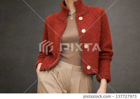 A girl wearing colorful knitwear. Fashionable design, modeling sample. A girl wearing colorful knitwear. Fashionable design, modeling sample. 137727973