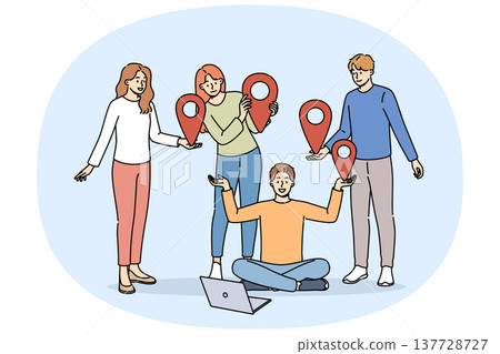 Team of students uses online communication on network, standing near laptop and holding geotags 137728727