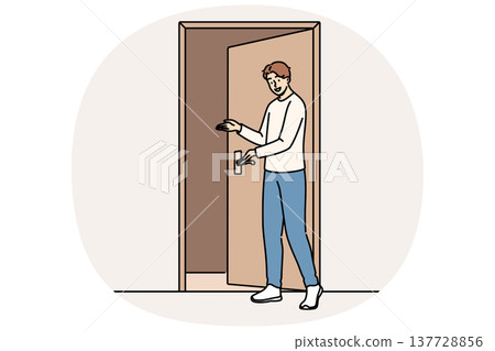Man says welcome standing near door and shows inviting gesture when friends come to visit Man says welcome standing near door and shows inviting gesture when friends come to visit 137728856