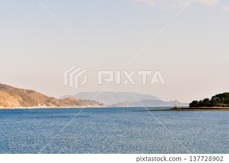 Murozumi Bay at sunset, with a lighthouse 137728902