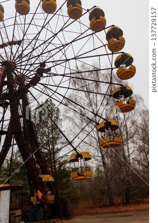 Abandoned Ferris Wheel in the amusement park of ghost town Pripyat in Chernobyl Exclusion Zone, Ukraine 137729157