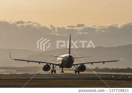 Sendai Airport at dusk, airplane taking off, Natori City, Miyagi Prefecture 137729621