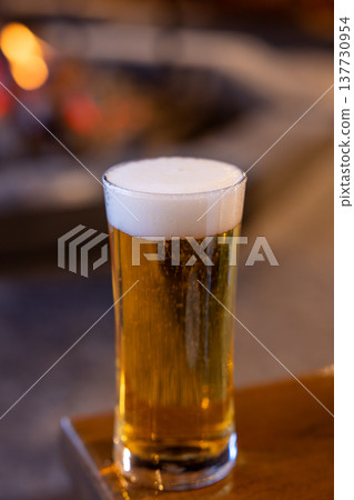 A delicious draft beer enjoyed by the fireplace in winter 137730954