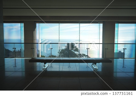 A view of the sparkling sea outside the window from the lobby of the MOA Museum of Art in Atami. A view of the sparkling sea outside the window from the lobby of the MOA Museum of Art in Atami. 137731161
