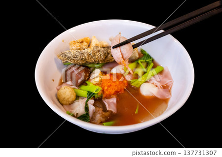 Top view of Yentafo Pink seafood flat noodles with fish meatballs, focus selective Top view of Yentafo Pink seafood flat noodles with fish meatballs, focus selective 137731307