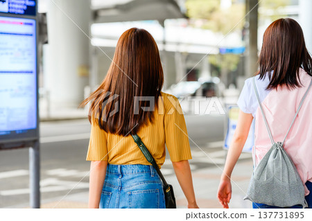 Two women checking information at a train station. ■Filming assistance provided by: Kansai International Airport (KIX) Two women checking information at a train station. ■Filming assistance provided by: Kansai International Airport (KIX) 137731895