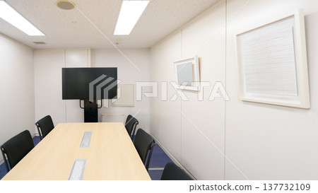 A bright conference room with a large monitor. A bright conference room with a large monitor. 137732109