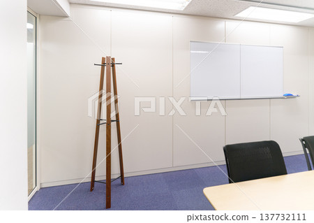 Meeting room with whiteboard and coat rack 137732111